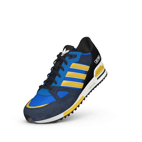 sapatillas azules con las liñas amarillas adidas deportivas